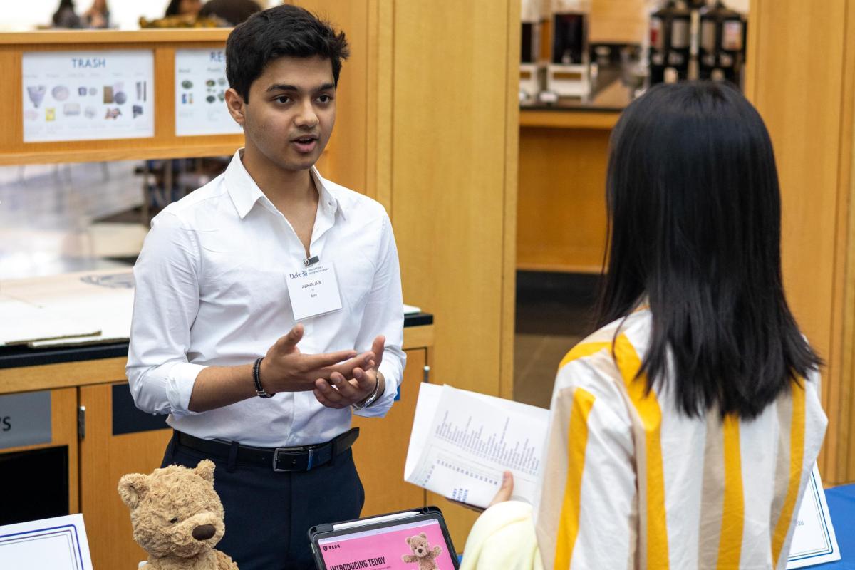 2024 Duke Startup Shocase. Avihan Jain discusses his venture, Bern, with a student