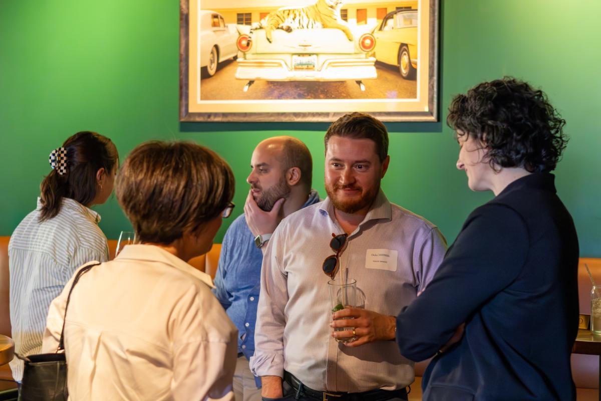 Members of the 2025 Cohort of the Entrepreneurial Leaders Network talking at a bar