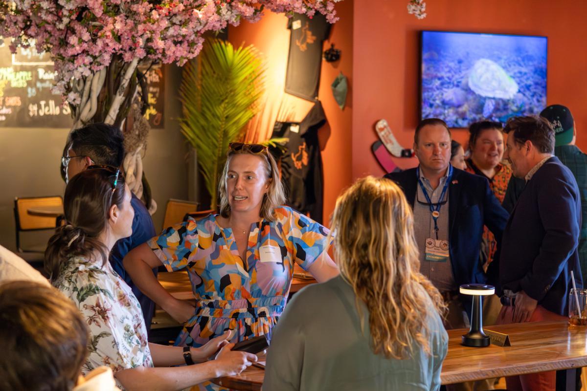Members of the 2025 Cohort of the Entrepreneurial Leaders Network talking at a bar