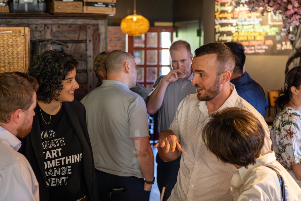 Members of the 2025 Cohort of the Entrepreneurial Leaders Network talking at a bar